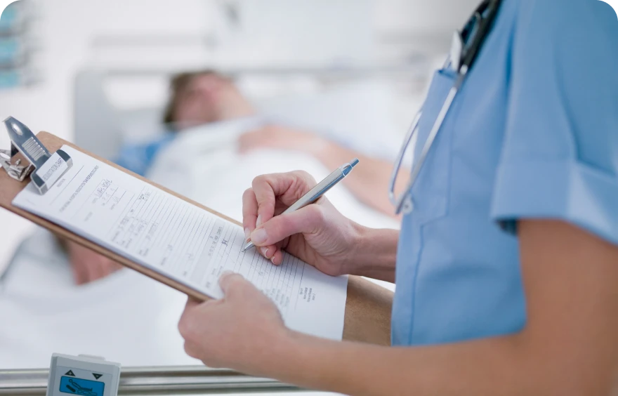 Healthcare worker with patient chart